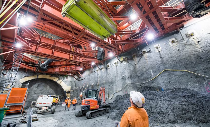 Construction worker looking at metro tunnel construction