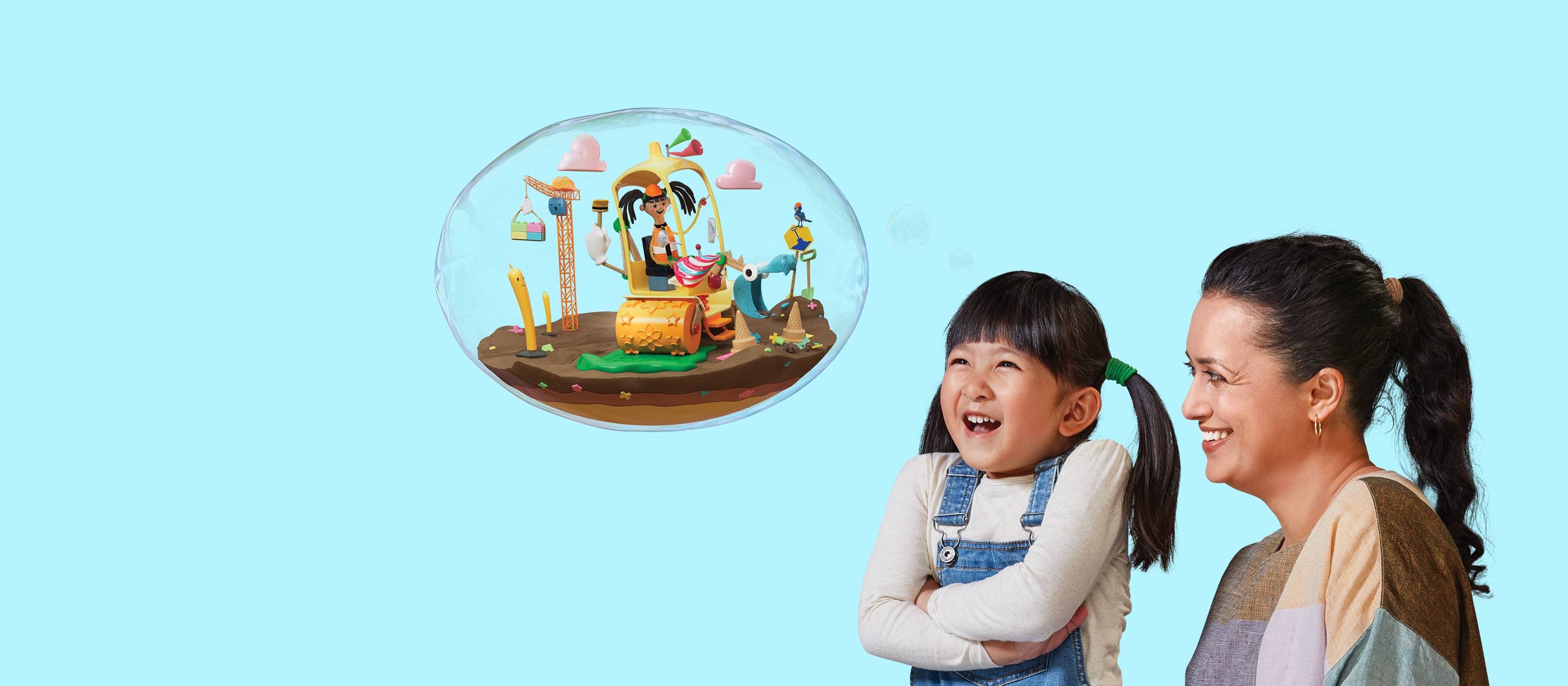 A young girl in overalls and pigtails laughs excitedly at a bubble in the air while a woman smiles at her. Inside the bubble, an animated figure digs on a construction site.