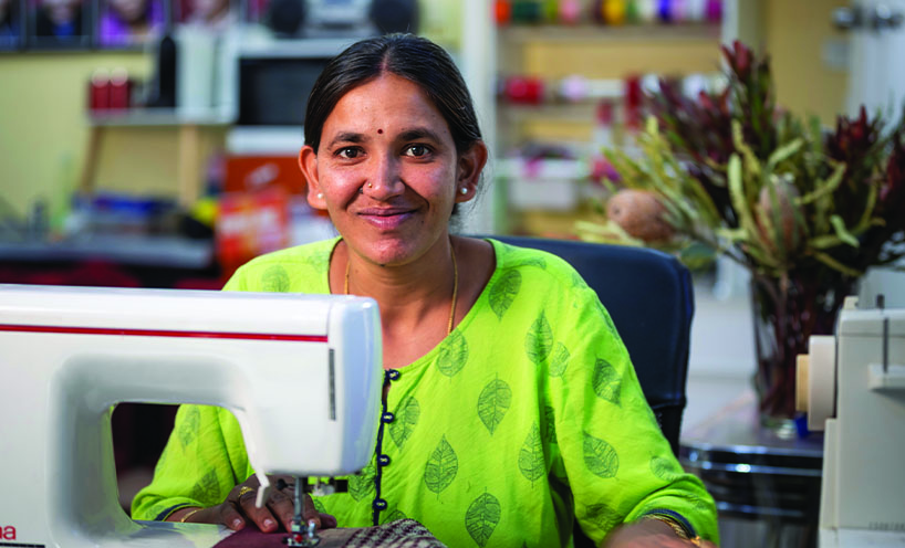 Female Paw Po Products staff member sewing