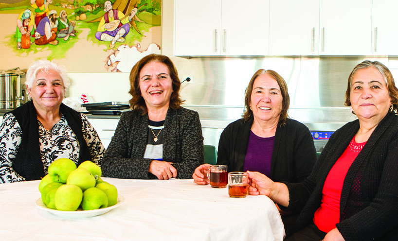 Greek women having lunch at a community centre 