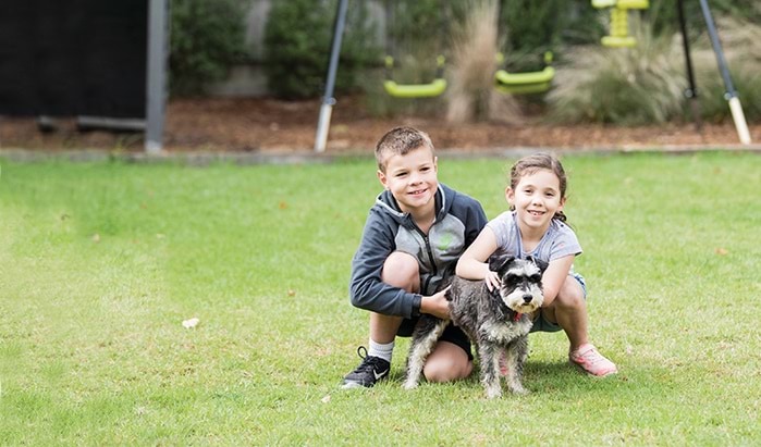 Children with a pet dog