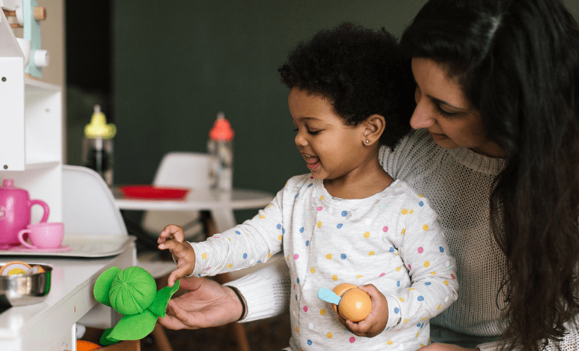 Woman and child playing together