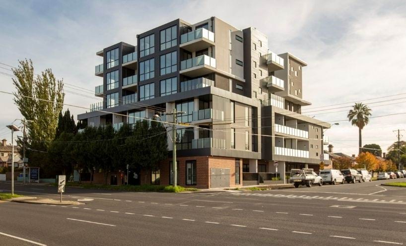 Photo of corner apartment building