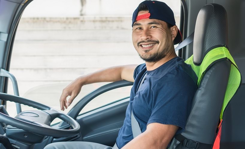 Truck driver sitting in the driver's seat