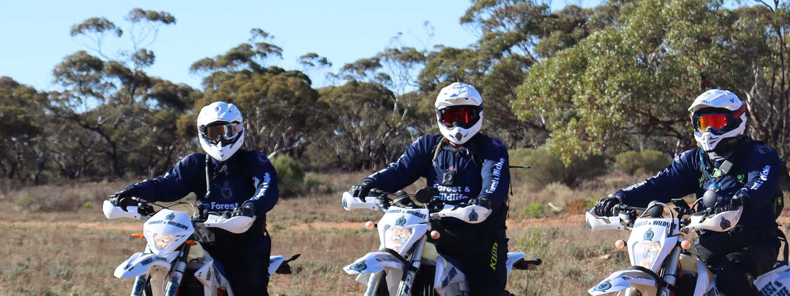 Image of wildlife officers on dirt bikes