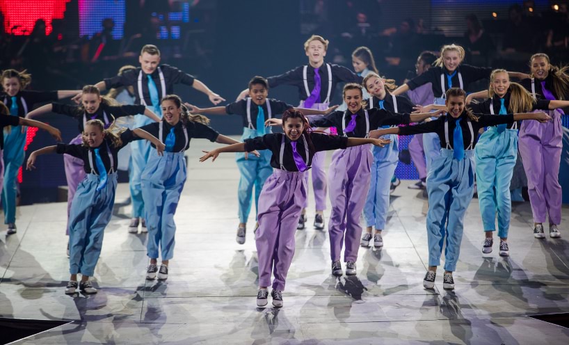 Dancers performing in colourful outfits