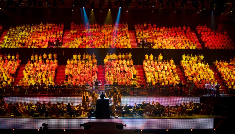 Students singing in a large mass choir