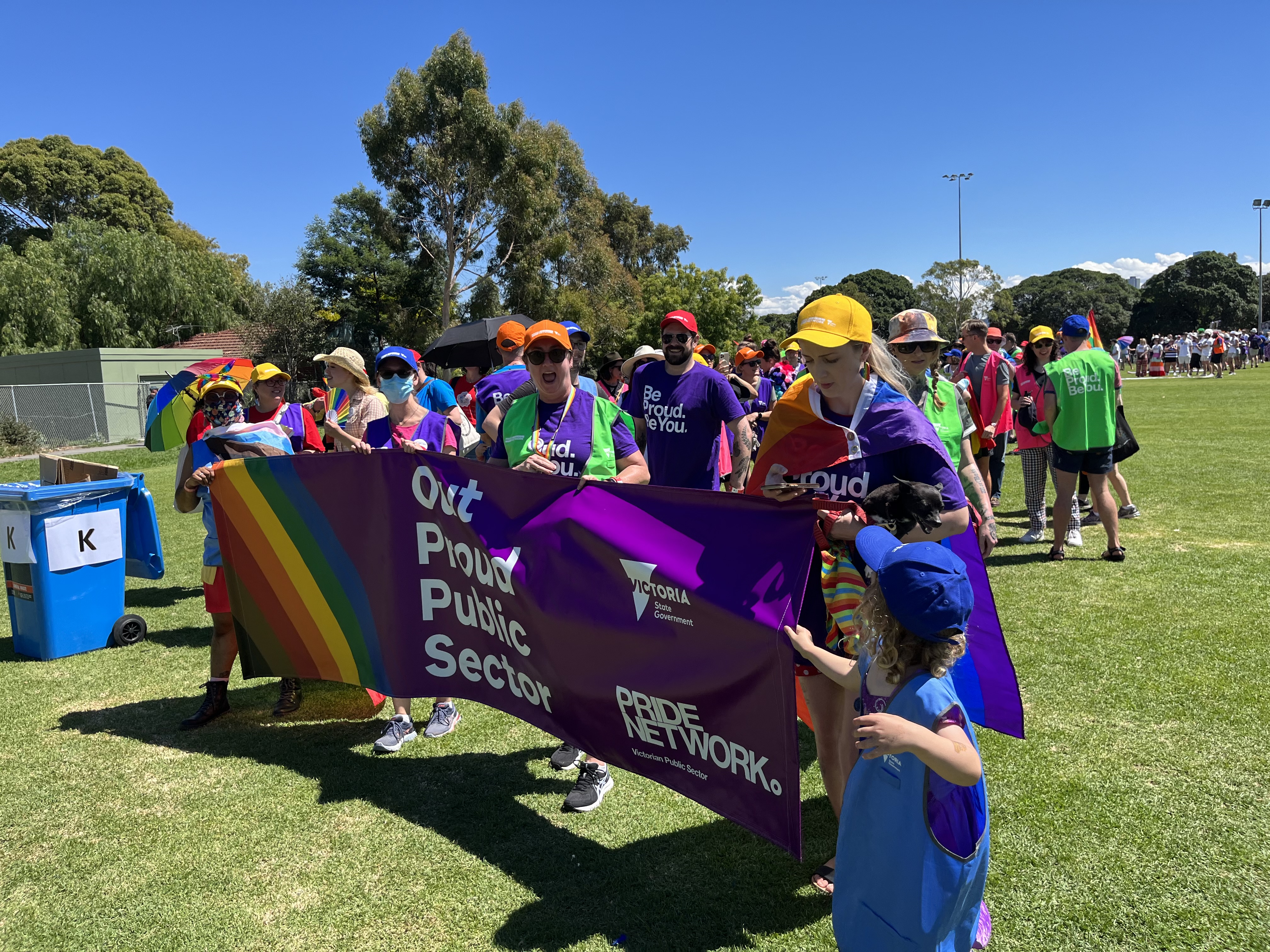 People holding the VPS LGBTIQ+ Pride Network banner at the 2022 Midsumma Pride March