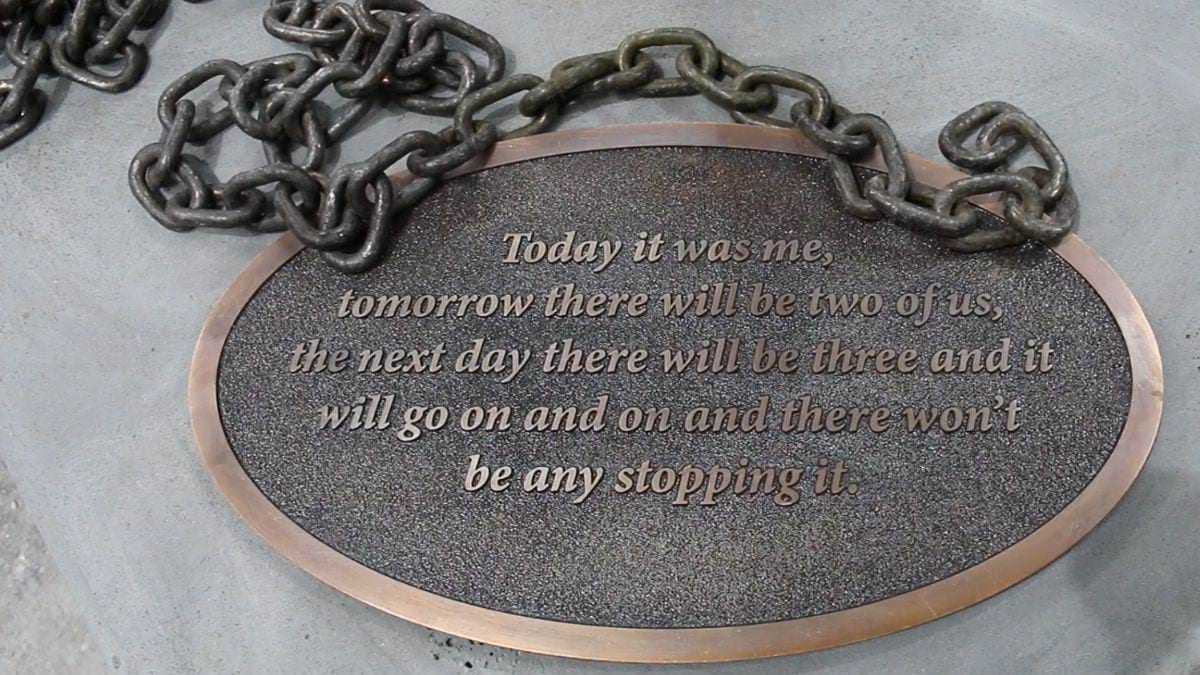 The plaque on the base of Zelda's statue. It has her quote 