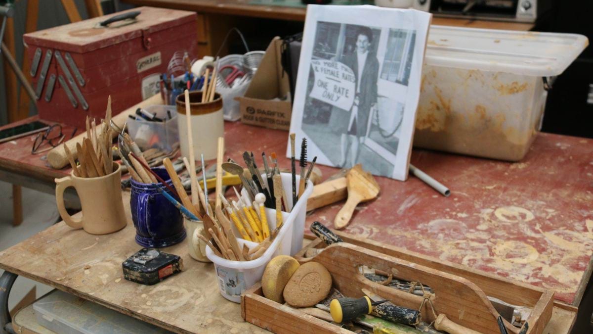 In studio, the photograph of Zelda is resting nearing the array of tools used by the sculptor Jennifer Mann.