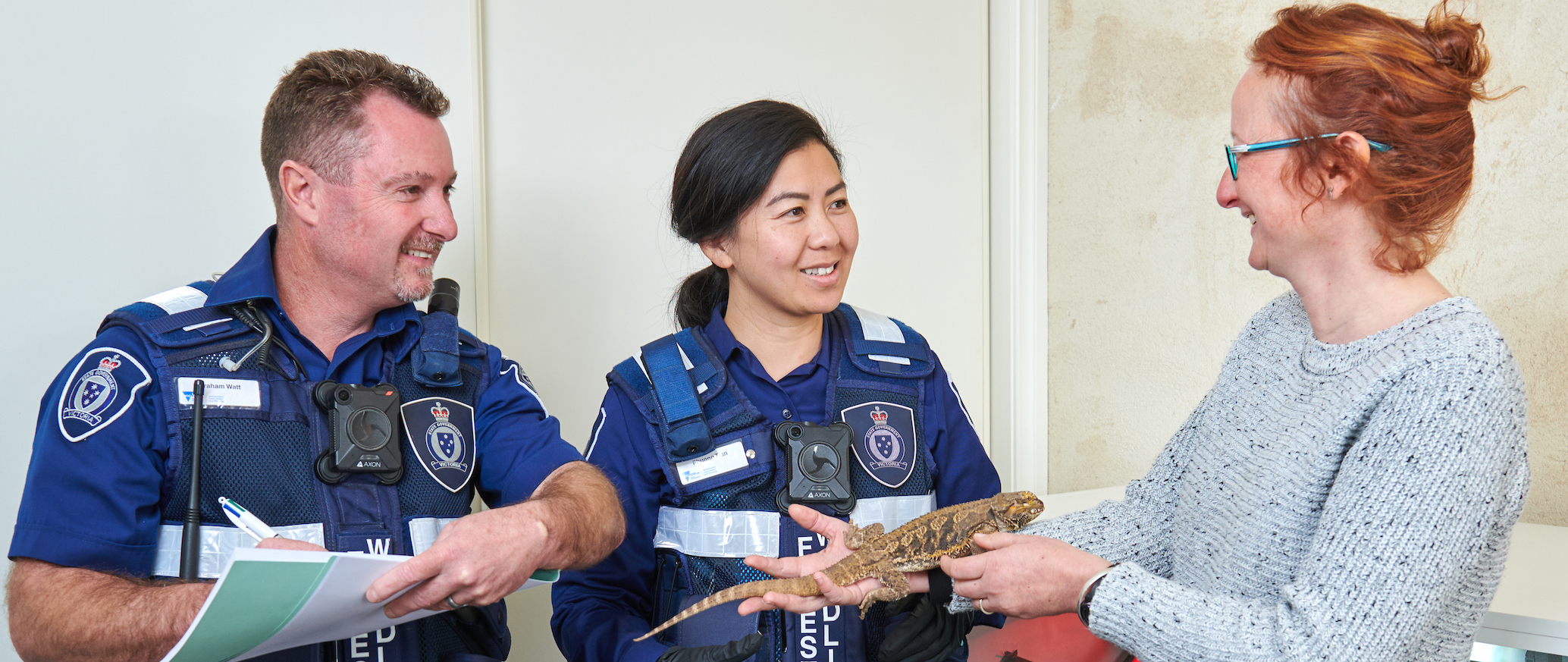 Photo of officers speaking to a lady about wildlife permits