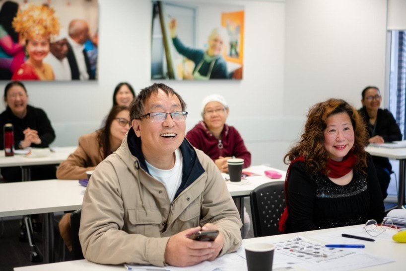 Adult learners participating in a class