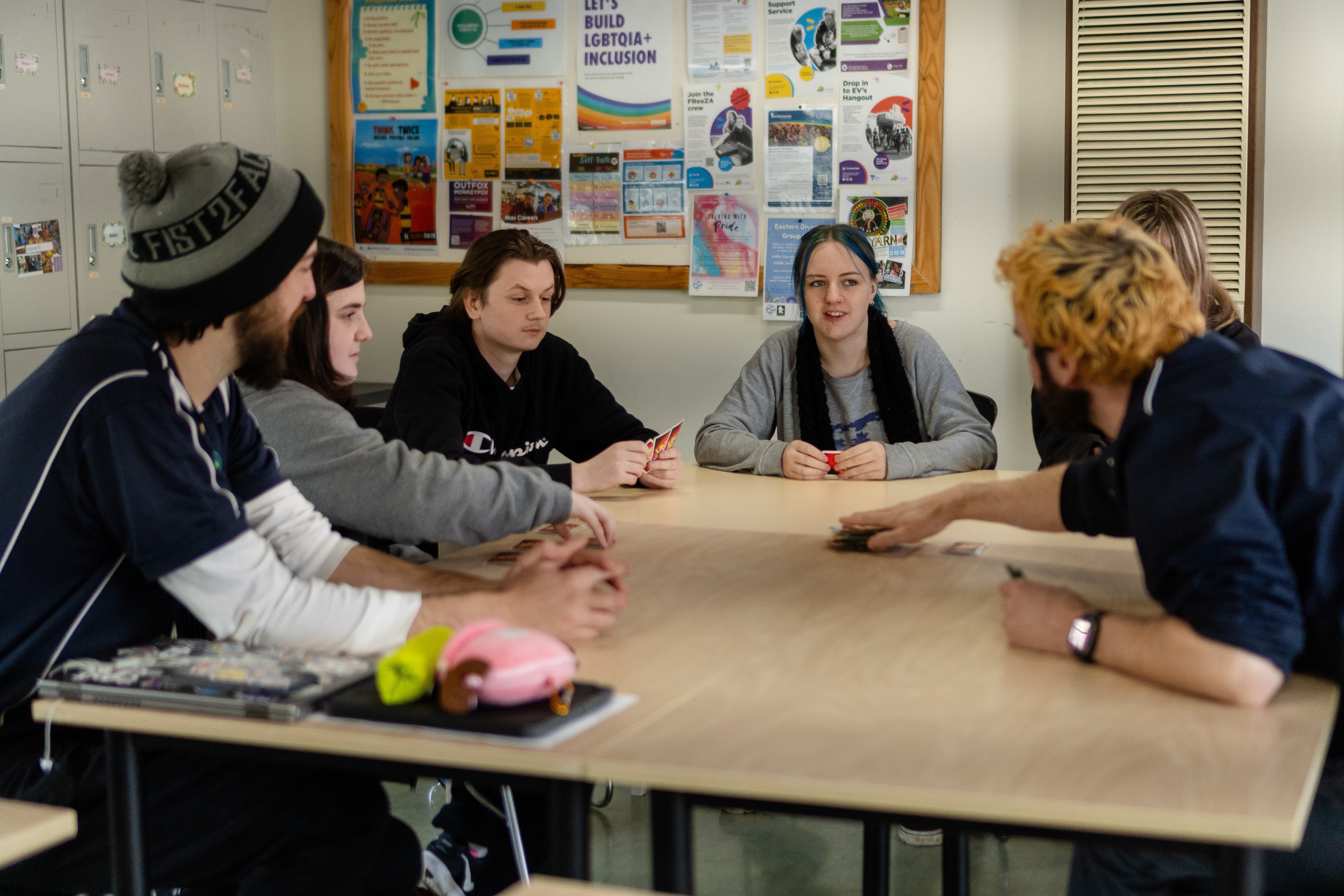 A group of Mountain District Learning Centre students participating  in learning around a classroom table