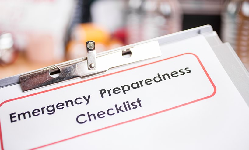 Image of a clipboard with and piece of paper with the heading Emergency Preparedness Checklist.