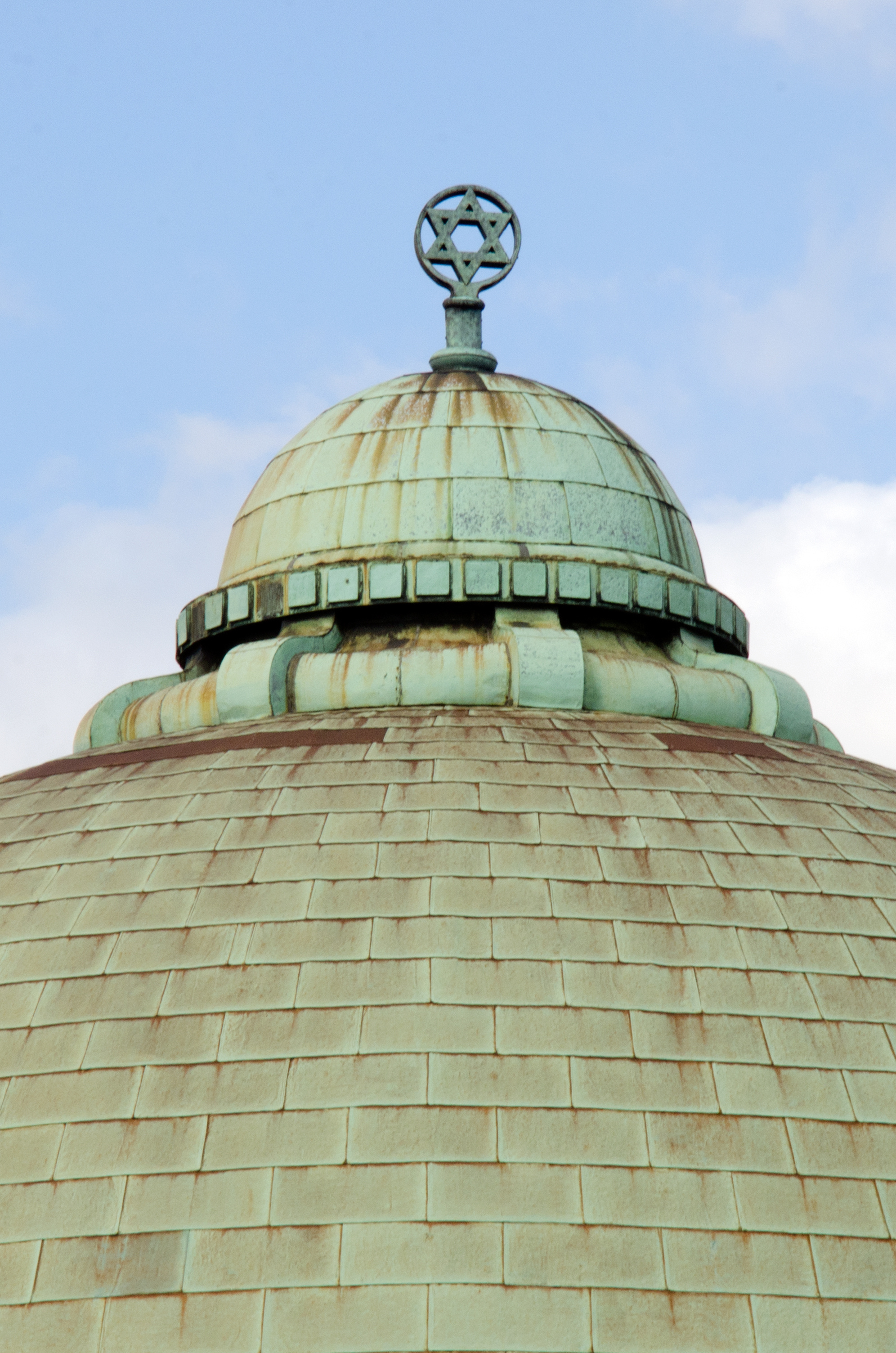 Detail of the dome of a synagogue topped with a star of David.