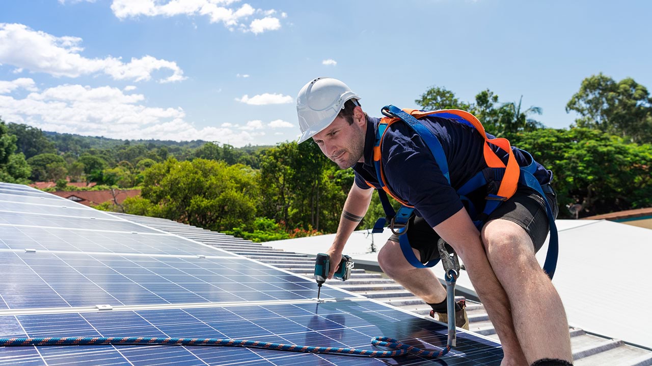 Solar panel being installed on rooftop