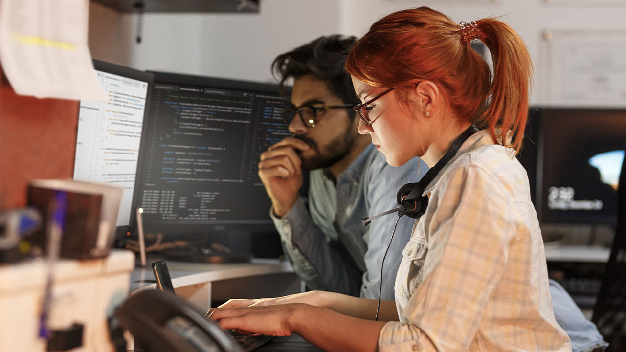 Two people working together in an office setting