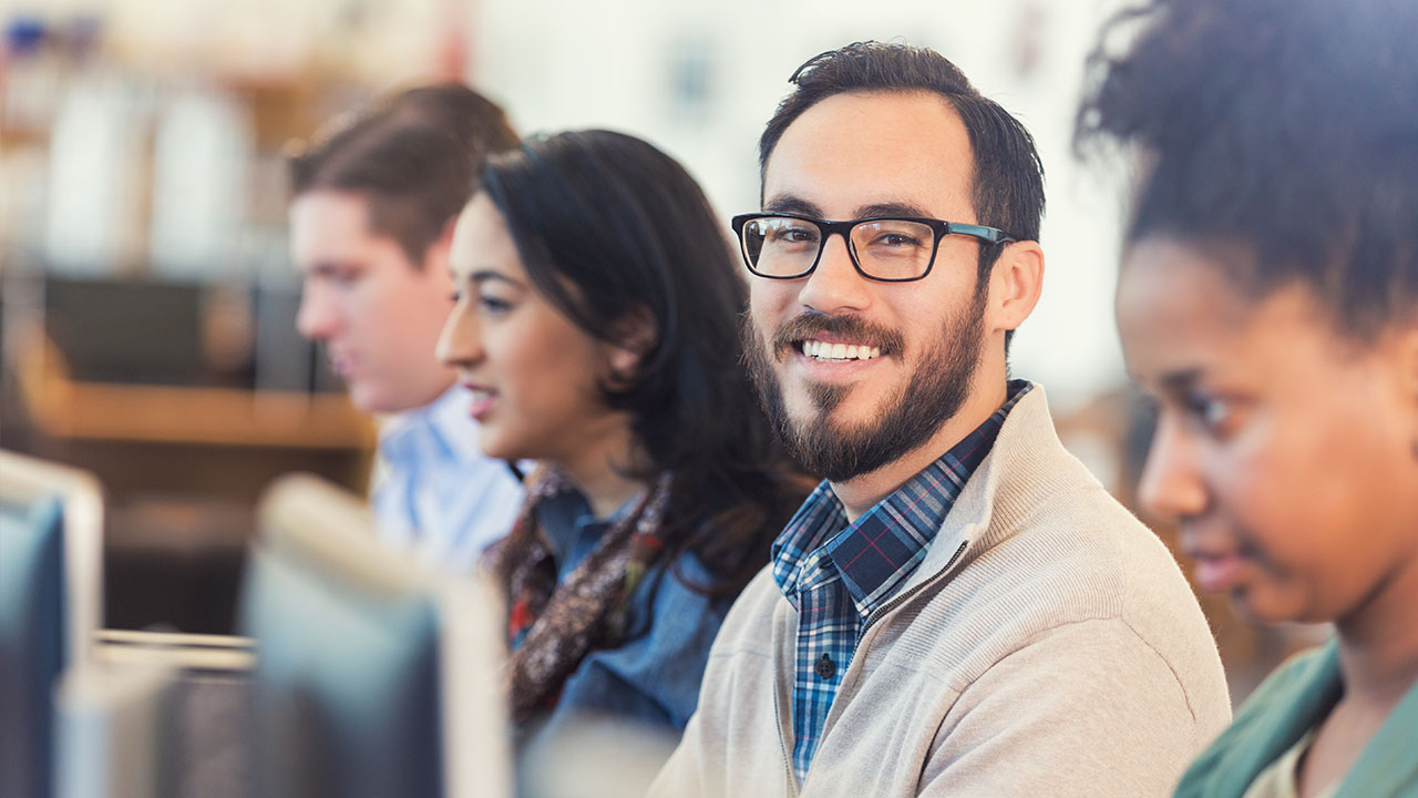 Person looking into the camera in an office setting