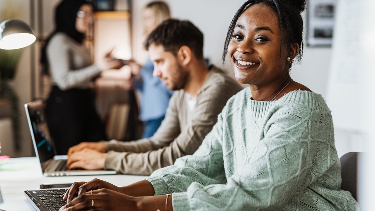 Person looking into the camera in an office setting