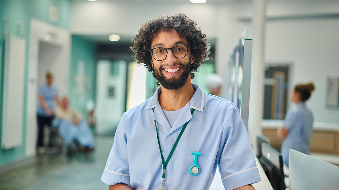 Nurse looking into the camera in a hospital setting