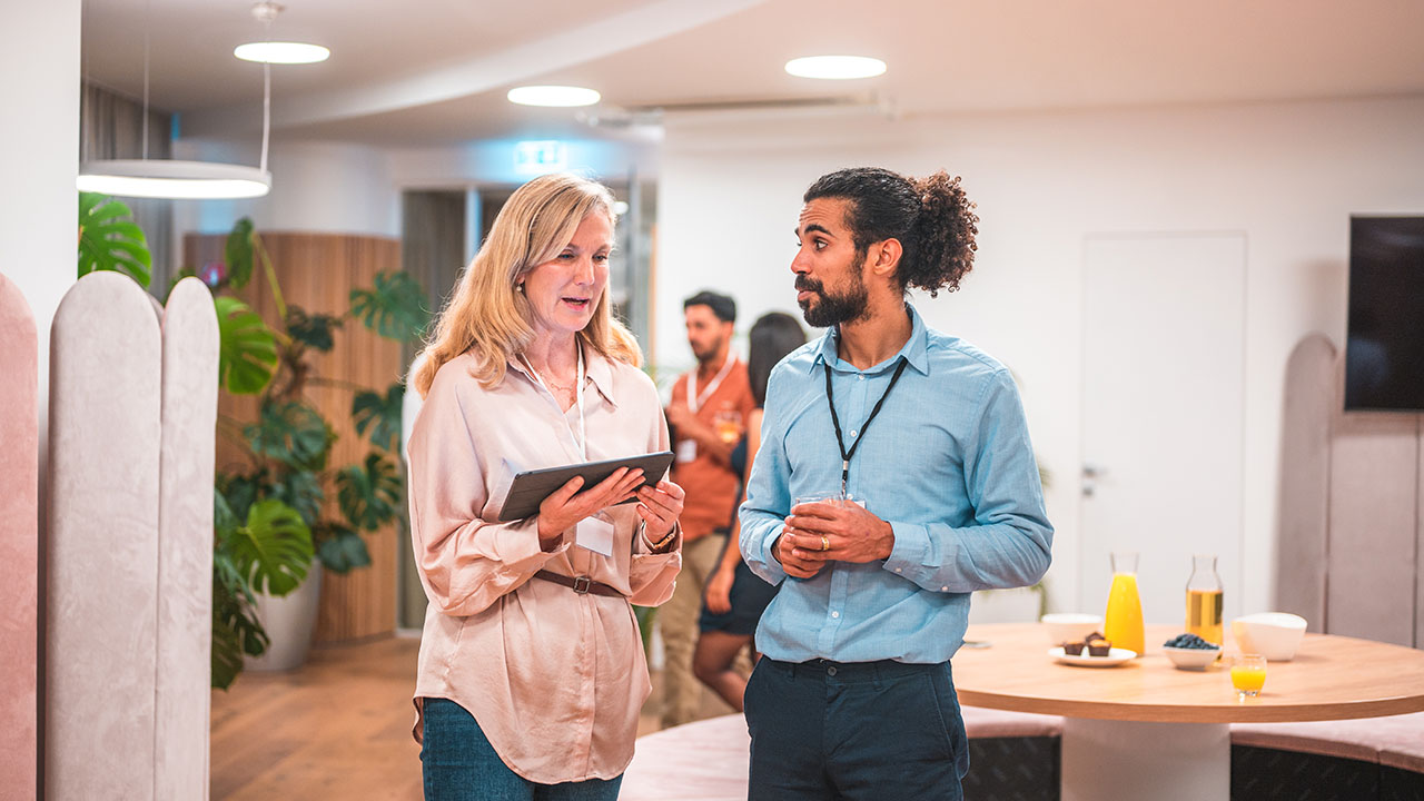 Two people in a discussion in a modern office