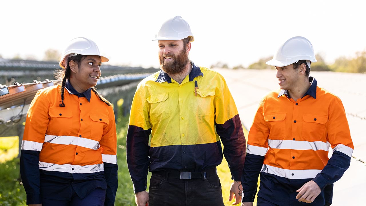 Three solar farm engineers