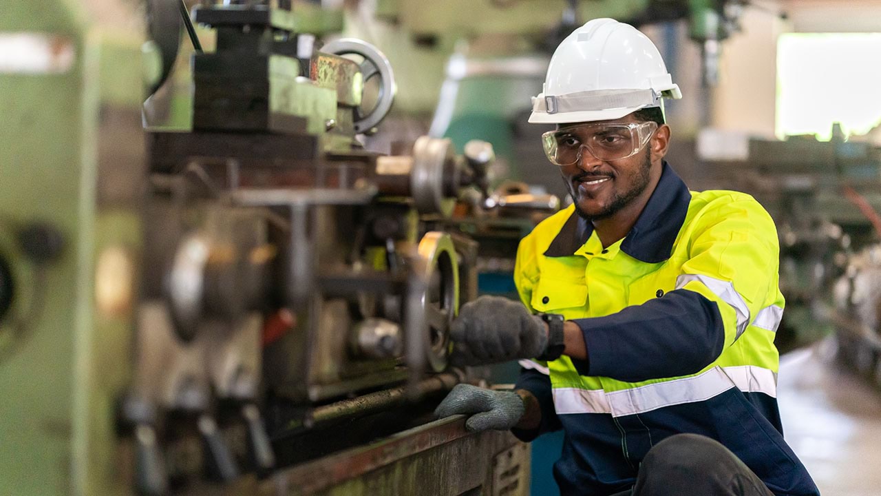 Person working on lathe