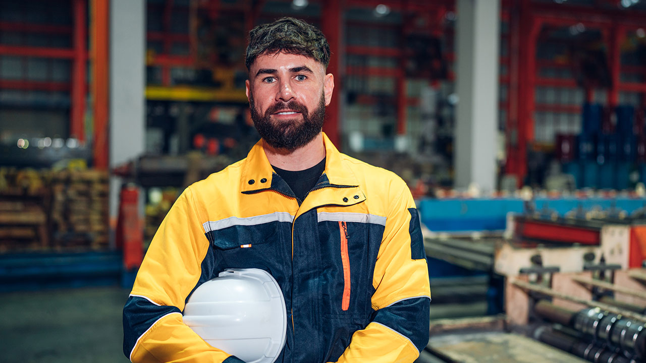 Sheetmetal worker in workshop setting