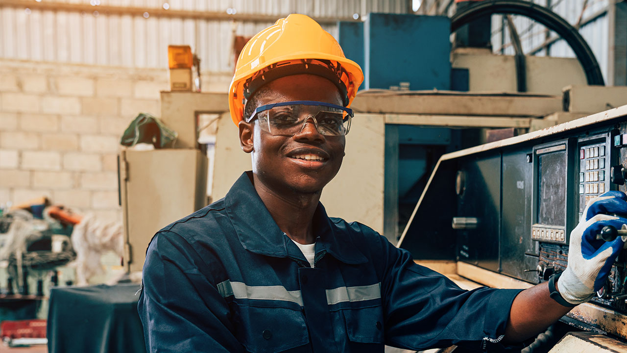 Student looking into camera in a workshop setting