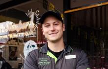 Person standing in front of a butcher shop