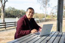 VTA finalist Angelika Fevaleaki sitting near a river