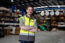 Person wearing hi vis standing in a factory