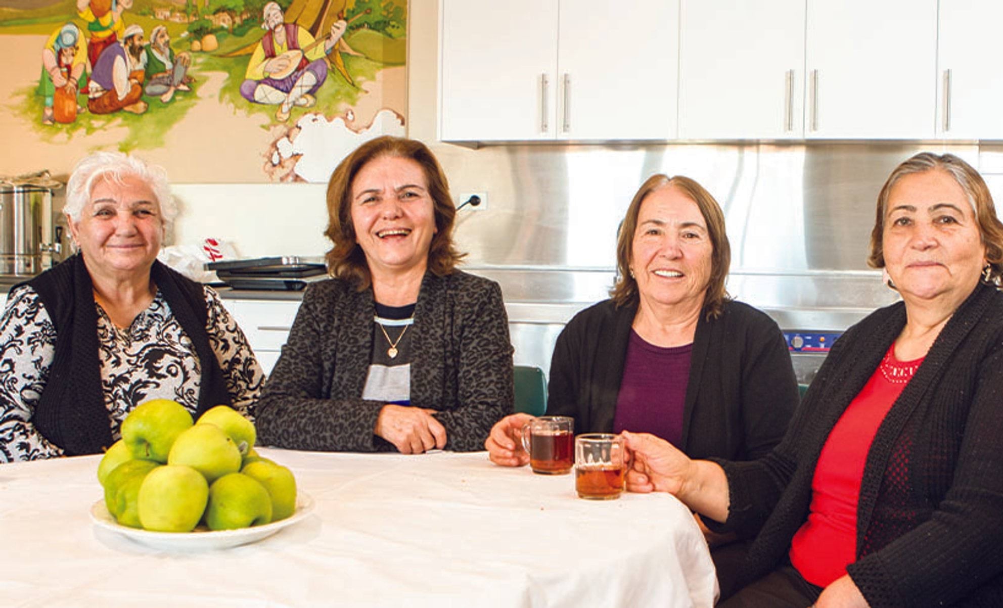 Greek women having lunch at a community centre 