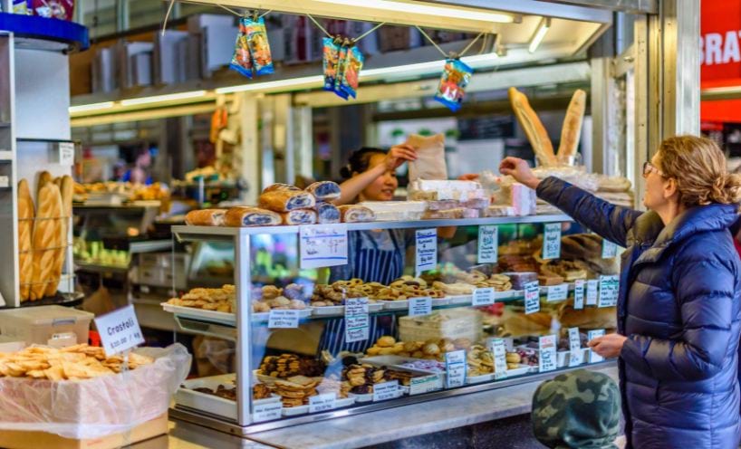 Person shopping at market cafe