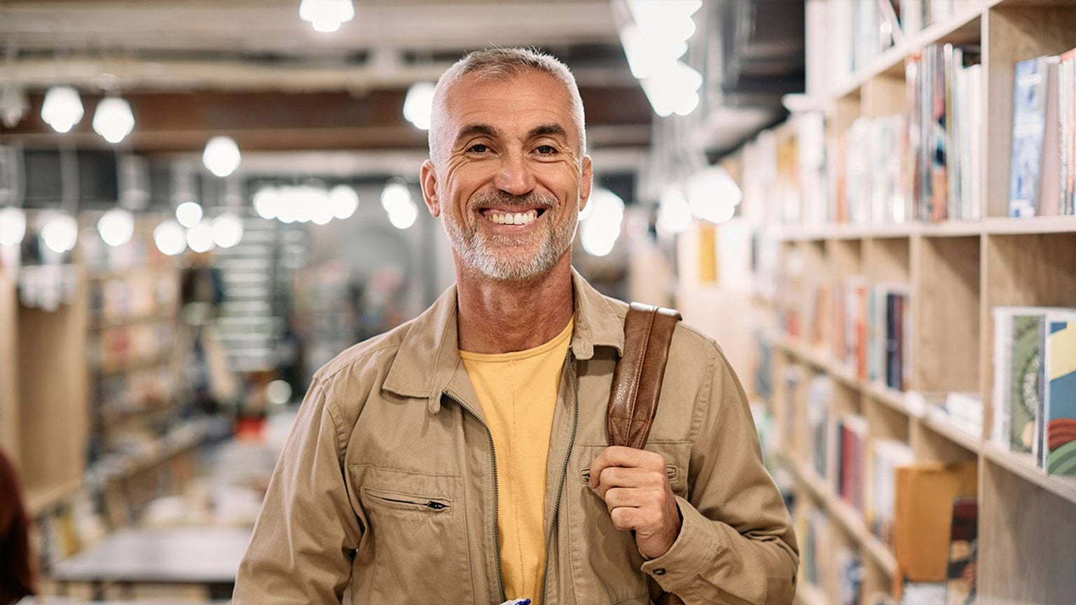 Person looking into the camera in a library setting