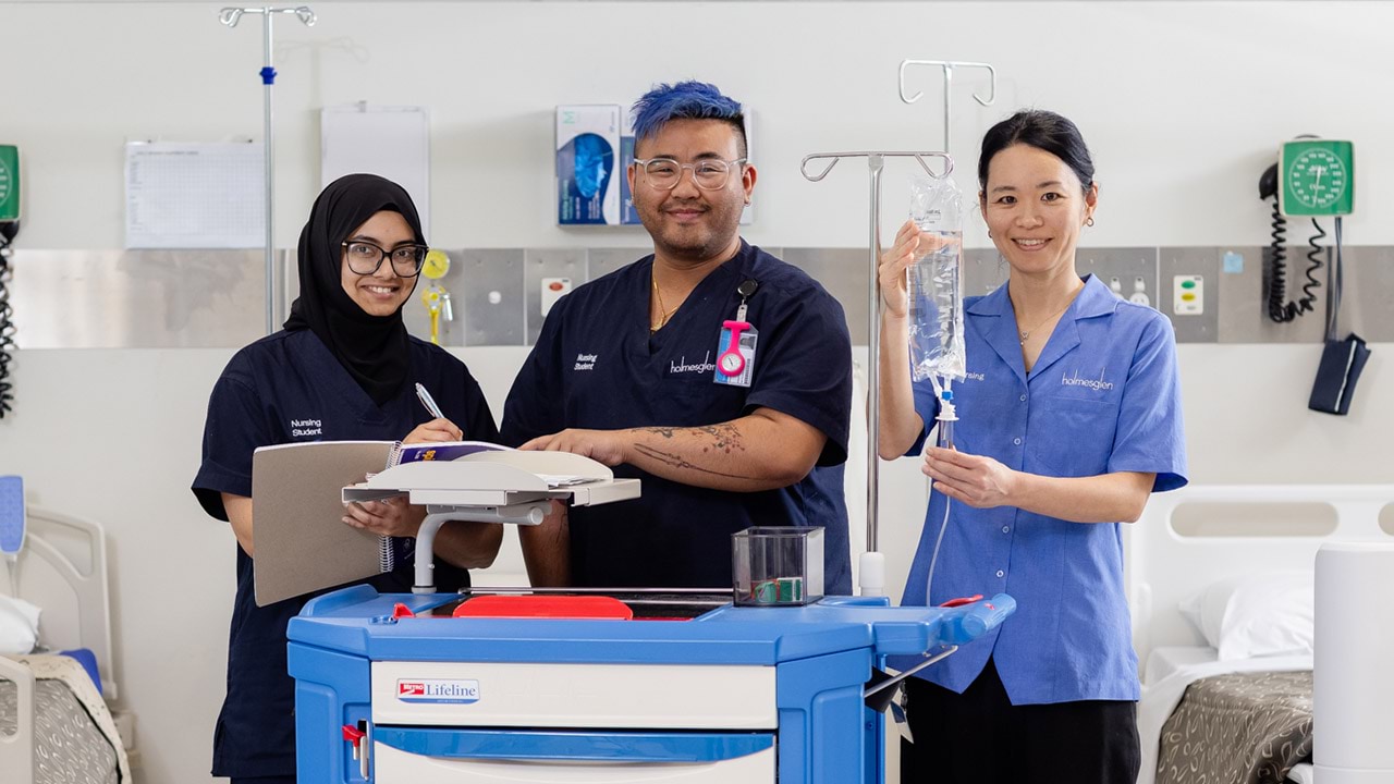 Two female and one male nursing student in a practical class at TAFE