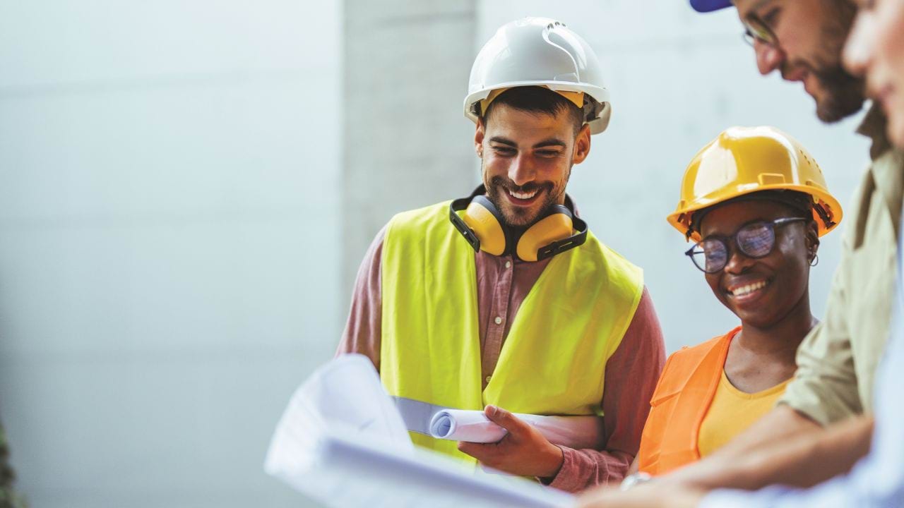 Group of people in high-vis clothing and hard hats