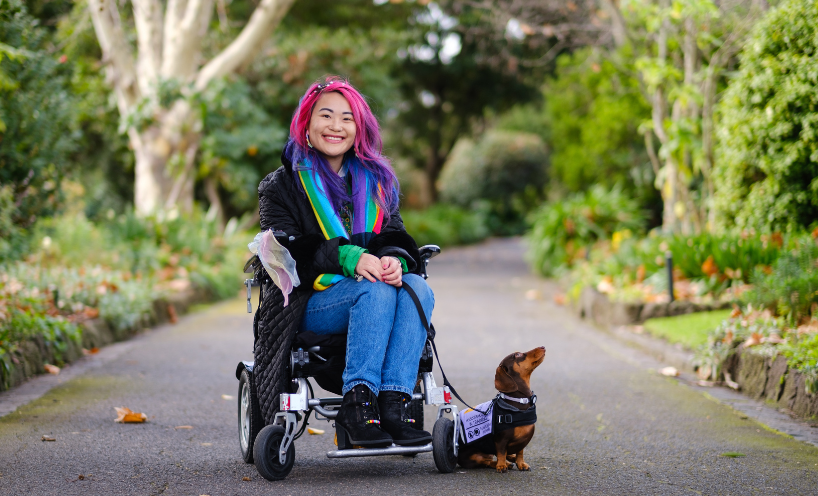 Akii and her dog Arri, a miniature dachshund