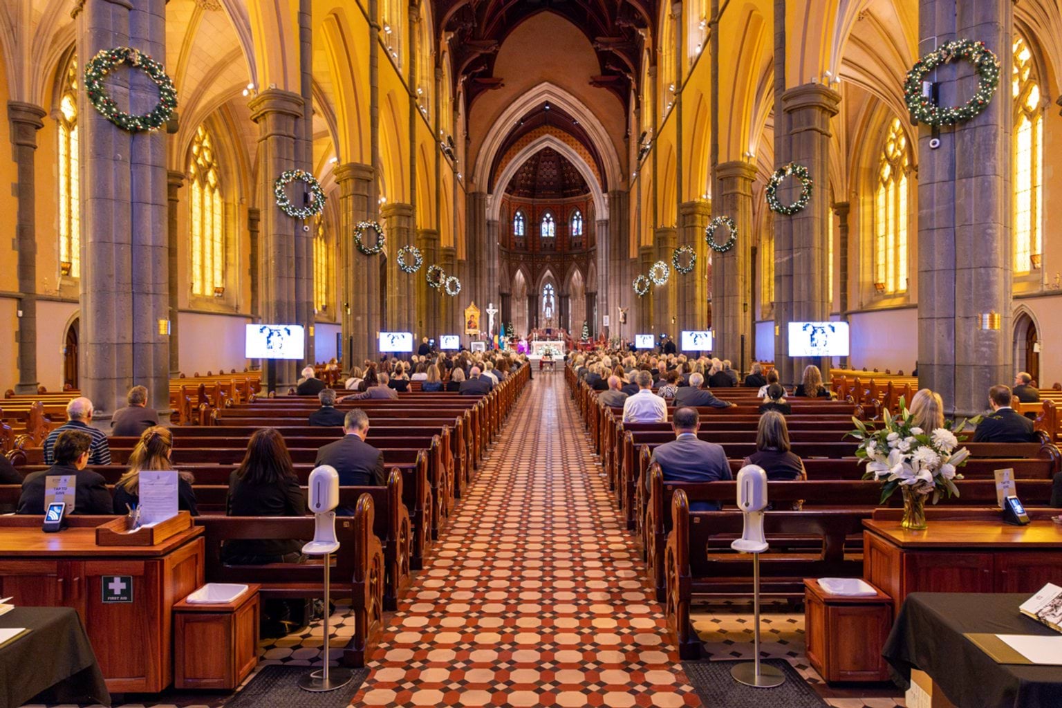 Attendees in St Patrick's Cathedral for the State Funeral Service for Neale Fraser AO MBE