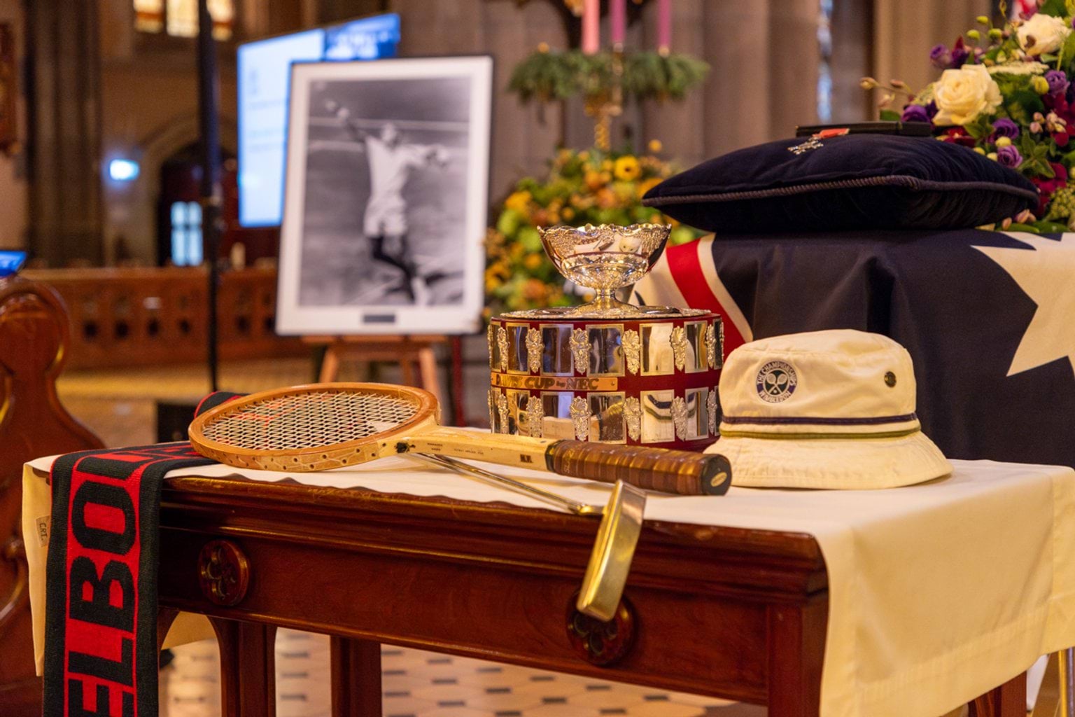 Tennis racquet, hat, scarf and trophy at the State Funeral Service for Neale Fraser AO MBE