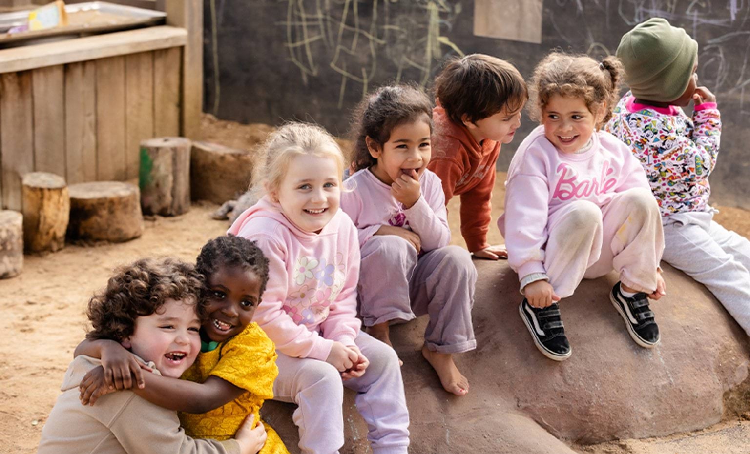 Victorian Skilled Visa Nomination program Children sitting on a sand mound and laughing