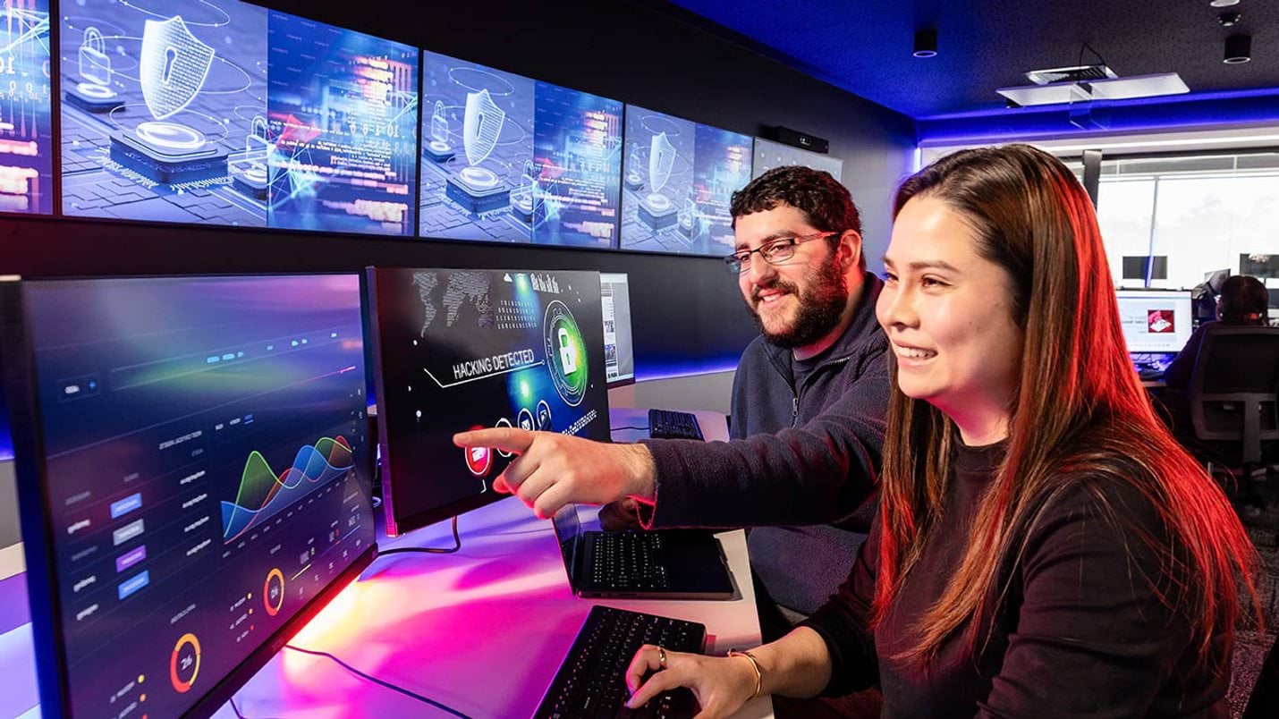 A student and teacher looking at two computer screens - Victorian Skills Plan for 2025 into 2026 cover image