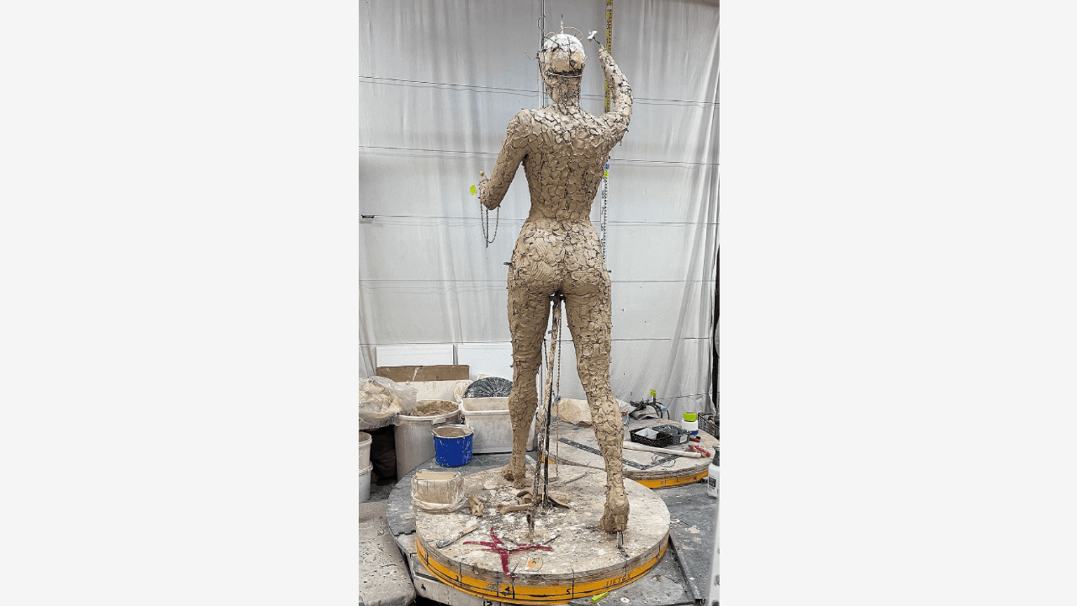 Barbara Rae armature and rough clay figure sculpting full body from back