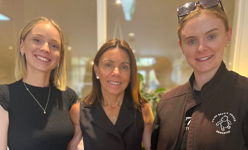 3 people smiling for the camera