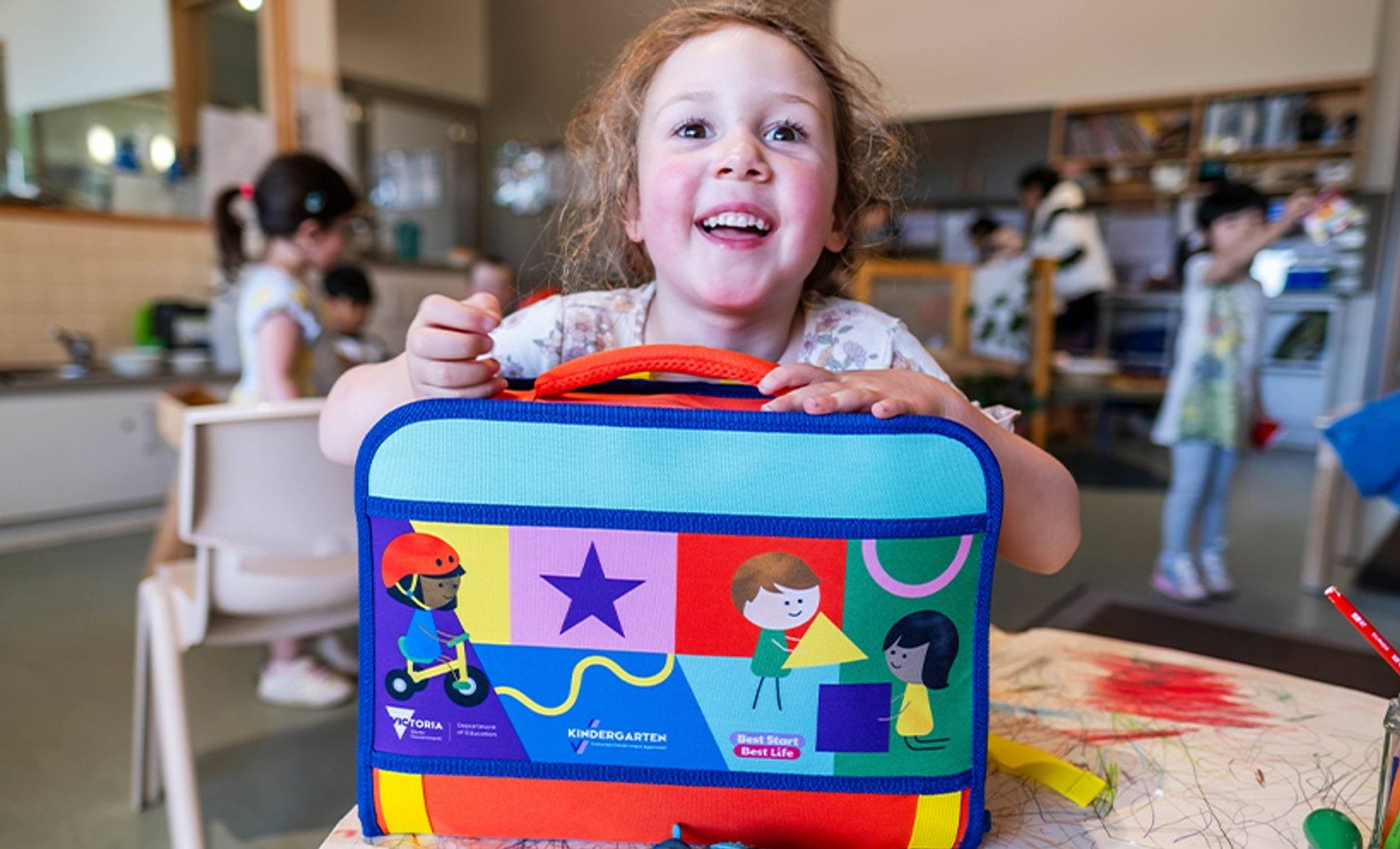 A kinder student showing their Kinder Kit 2026