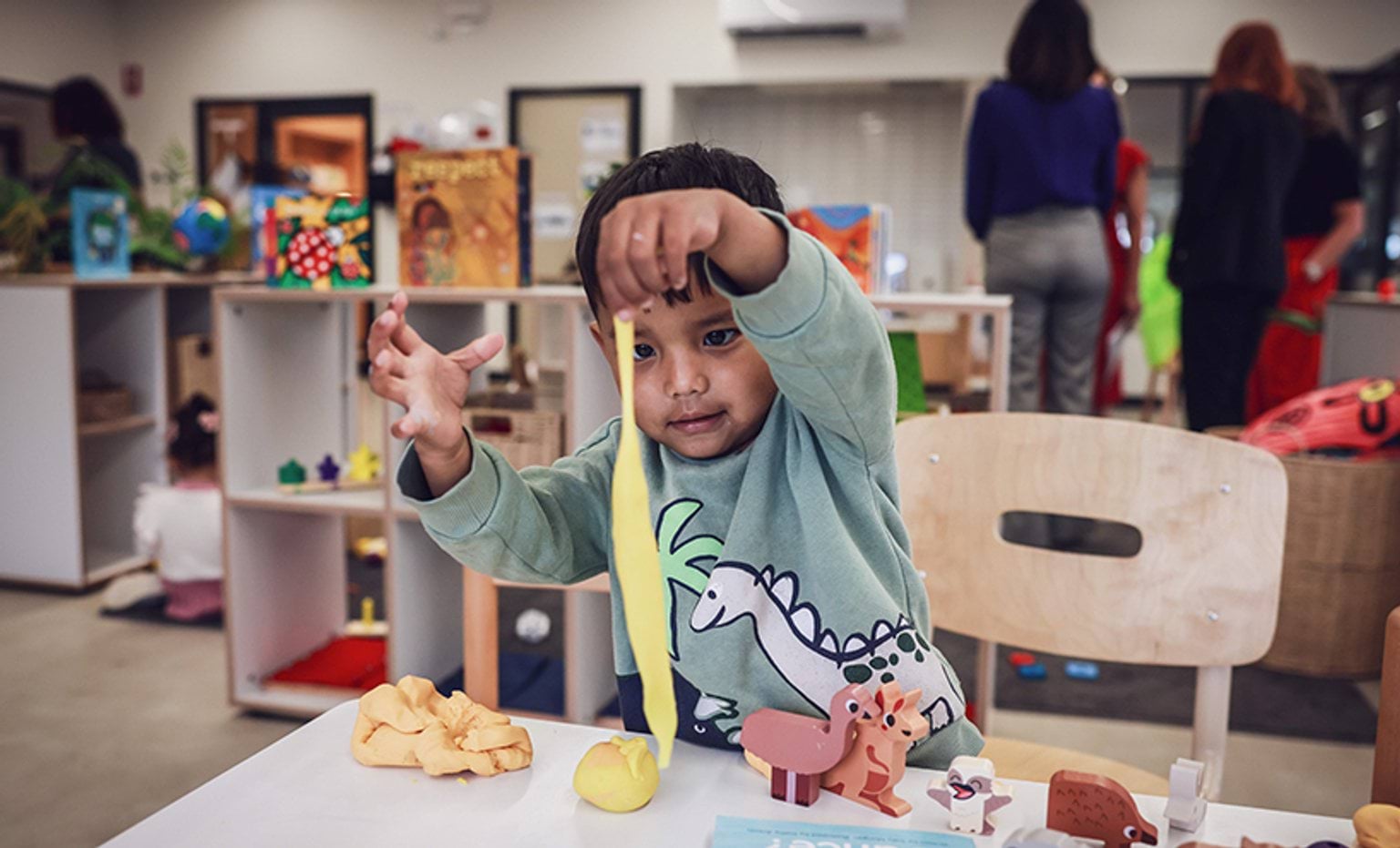 A child playing with play dough